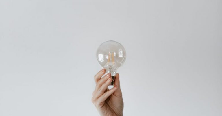 Innovations - Anonymous female showing light bulb