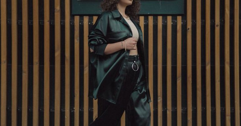 Trends - Young Woman in Fashion Trends Posing on a Wall Signage