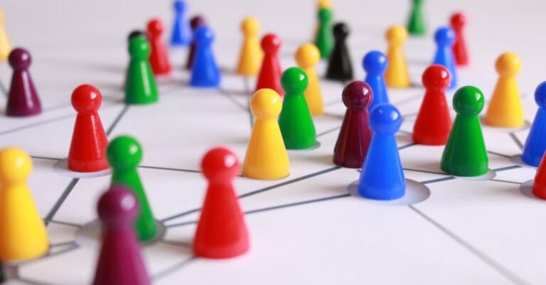 Networks - Close Up Photography of Yellow Green Red and Brown Plastic Cones on White Lined Surface