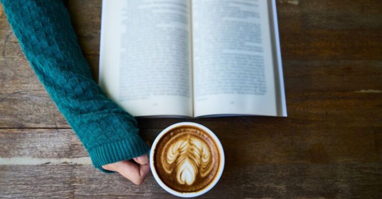 Course - Person Having Cup of Latte While Reading Book